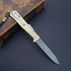 Otter Mercator Brass Damascus With Clip 10 Otter Mercator Brass Damascus With Clip -KNIFE LOUNGE Sales mercatormessingdamastmitclip